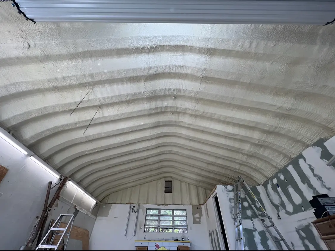 Spray polyurethane foam applied to the underside of a metal roof deck in Fair Oaks